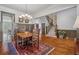 Elegant dining room featuring hardwood floors, a chandelier, and staircase access at 4541 Gateway Se Ct, Smyrna, GA 30080