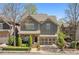 Charming home with stone accents, a well-manicured lawn, and an attached two car garage at 4541 Gateway Se Ct, Smyrna, GA 30080