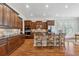 Chef's kitchen featuring hardwood floors, stainless appliances, and a kitchen island with barstool seating at 4541 Gateway Se Ct, Smyrna, GA 30080