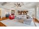 Open concept living room featuring hardwood floors, natural light, and seamlessly connected kitchen at 4541 Gateway Se Ct, Smyrna, GA 30080