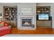 A cozy fireplace featuring built-in shelving units flanking both sides at 4541 Gateway Se Ct, Smyrna, GA 30080