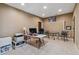 This large carpeted office features a computer desk, rolling chair, round table, and recessed lighting at 4541 Gateway Se Ct, Smyrna, GA 30080