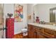 Stylish powder room featuring granite counters, dark wood cabinets, and decorative accents at 4541 Gateway Se Ct, Smyrna, GA 30080