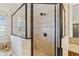 Close up of a tile shower with a glass surround and bronze fixtures at 4541 Gateway Se Ct, Smyrna, GA 30080