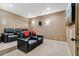 Enjoy movies in this theater room with leather recliners, sconce lighting, neutral carpet, and a large flat screen tv at 4541 Gateway Se Ct, Smyrna, GA 30080