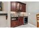 This wet bar has an ice maker, microwave, wine cooler, gorgeous granite countertops and mosaic tile backsplash at 4541 Gateway Se Ct, Smyrna, GA 30080