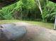 Picturesque backyard with lush greenery and mature trees, offering a serene outdoor space at 1829 Mercer Ave., College Park, GA 30337