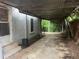 Attached carport providing covered parking and additional storage space at 1829 Mercer Ave., College Park, GA 30337