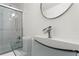 Modern bathroom features glass shower doors, unique sink and vanity at 2479 Peachtree Ne Rd # 305, Atlanta, GA 30305