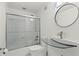 Modern bathroom with glass shower doors and stylish fixtures at 2479 Peachtree Ne Rd # 305, Atlanta, GA 30305