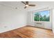 Spacious bedroom featuring hardwood floors and a large window with scenic views at 2479 Peachtree Ne Rd # 305, Atlanta, GA 30305