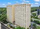Exterior view of high-rise building with many windows and trees, with surrounding parking and landscaping at 2479 Peachtree Ne Rd # 305, Atlanta, GA 30305