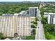 Exterior view of a high-rise apartment building with many windows with Atlanta's skyline in the background at 2479 Peachtree Ne Rd # 305, Atlanta, GA 30305