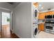 Bright kitchen featuring stainless steel appliances and adjacent laundry machines for added convenience at 2479 Peachtree Ne Rd # 305, Atlanta, GA 30305