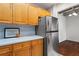 Kitchen features stainless steel refrigerator, tile backsplash, and shaker cabinets at 2479 Peachtree Ne Rd # 305, Atlanta, GA 30305