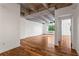 Spacious living room with hardwood floors and exposed concrete ceilings, filled with natural light at 2479 Peachtree Ne Rd # 305, Atlanta, GA 30305