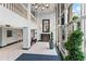 Elegant building lobby with modern decor, including plants, tile floors, and a seating area at 2479 Peachtree Ne Rd # 305, Atlanta, GA 30305