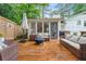 Inviting back deck with wooden flooring, comfortable seating, and a cozy fire pit, perfect for outdoor relaxation at 4120 Valley Wood Nw Dr, Marietta, GA 30064