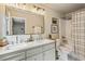 Stylish bathroom featuring a double vanity, modern fixtures, and a shower-tub combo, ensuring comfort and convenience at 4120 Valley Wood Nw Dr, Marietta, GA 30064