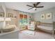 Cozy bedroom featuring neutral tones, natural light, ceiling fan, and Bedroom furniture at 4120 Valley Wood Nw Dr, Marietta, GA 30064