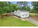 Well-maintained white house with a two-car garage and a beautifully landscaped front yard at 4120 Valley Wood Nw Dr, Marietta, GA 30064