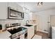 Modern kitchen with stainless steel appliances, white cabinets, and sleek countertops, a chef's delight at 4120 Valley Wood Nw Dr, Marietta, GA 30064