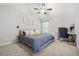 Bedroom with ceiling fan, soft carpet, desk and neutral decor at 4608 Treasure Ct, Forest Park, GA 30297