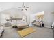 Large bedroom with sitting area, comfy bed and vaulted ceilings at 4608 Treasure Ct, Forest Park, GA 30297