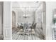 Dining room with wainscoting detail, coffered ceilings, and luxury vinyl plank flooring at 4608 Treasure Ct, Forest Park, GA 30297