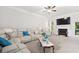 Comfortable living room with a fireplace, plush seating, and access to the backyard at 4608 Treasure Ct, Forest Park, GA 30297