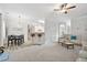 Open-concept living area with breakfast bar, wainscoting, and a plush sectional sofa at 4608 Treasure Ct, Forest Park, GA 30297