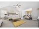 Spacious main bedroom with vaulted ceilings, sitting area, soft lighting and a luxurious king-size bed at 4608 Treasure Ct, Forest Park, GA 30297