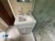Bathroom featuring new vanity with granite top and enclosed shower with marble surround at 4889 Fairforest Dr, Stone Mountain, GA 30088