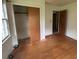 Bedroom with hardwood floors, a large closet, and a bright, open feel at 4889 Fairforest Dr, Stone Mountain, GA 30088