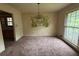 Dining room with painted wall decor and chandelier, open to adjacent room at 4889 Fairforest Dr, Stone Mountain, GA 30088