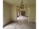 Dining room featuring decorative chandelier with archway into living space at 4889 Fairforest Dr, Stone Mountain, GA 30088