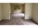 View of dining room with mauve carpet and chandelier at 4889 Fairforest Dr, Stone Mountain, GA 30088