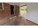 Enclosed patio area offering a seamless transition between indoor and outdoor spaces, and backyard access at 4889 Fairforest Dr, Stone Mountain, GA 30088