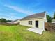 Spacious backyard featuring a well-maintained lawn, privacy fence, and patio area at 6100 Semaphore Rdg, Rex, GA 30273