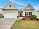 Well-maintained home with a two-car garage, landscaping, and beautiful curb appeal at 6100 Semaphore Rdg, Rex, GA 30273