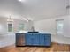 Kitchen island with a sink, stainless dishwasher, and blue cabinets at 6100 Semaphore Rdg, Rex, GA 30273