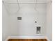 A laundry room with hookups and wire rack shelving at 6100 Semaphore Rdg, Rex, GA 30273