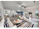 Open-concept living space with modern decor, seamlessly connecting living, dining, and kitchen areas at 6100 Semaphore Rdg, Rex, GA 30273