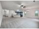 Spacious open floor plan featuring updated kitchen, island, and large living area with neutral carpeting at 6100 Semaphore Rdg, Rex, GA 30273