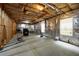 Unfinished basement with exposed insulation, concrete floors, and window at 1536 Fenmore St, Lithia Springs, GA 30122