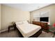 Bedroom with neutral decor, a bed, dresser, and side tables at 1536 Fenmore St, Lithia Springs, GA 30122