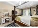 Bedroom featuring a four-poster bed, and a vanity with mirror and stool at 1536 Fenmore St, Lithia Springs, GA 30122