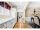 The dining room has a view into the kitchen and white wainscoting at 1536 Fenmore St, Lithia Springs, GA 30122