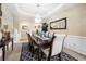 Dining room with tray ceiling, chandelier, and elegant furnishings at 1536 Fenmore St, Lithia Springs, GA 30122