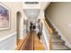Elegant foyer with hardwood floors, staircase, and arched doorways at 1536 Fenmore St, Lithia Springs, GA 30122